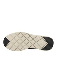 Zwarte sneakerzool met een textuurpatroon, voorzien van een crèmekleurige rubberen basis en een zwart traction ontwerp, dat grip en stabiliteit biedt.