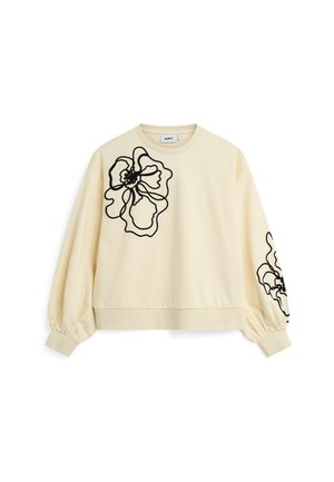 Cremefarvet sweatshirt med sort blomsterkontur broderi på venstre bryst og højre ærme, med ballonsleeves og ribbede manchetter.