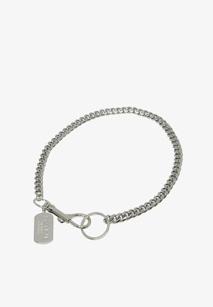 Silver metal chain bracelet featuring interlocking links. Includes a clasp and a tag with engraved text, finished with a polished surface.
