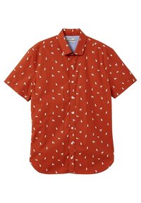 Chemise à manches courtes couleur orange rouille avec des silhouettes blanches de chiens réparties uniformément sur le tissu et un col pointu.