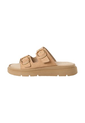 Sandale à enfiler en daim marron avec deux brides ajustables dotées de boucles dorées. Semelle épaisse et rembourrée de couleur beige clair.