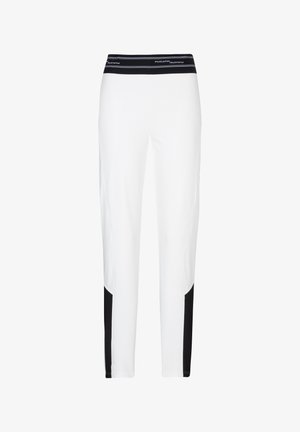 Witte slim-fit broek met zwarte elastische tailleband en zwarte kleurvlakken op de onderbenen.