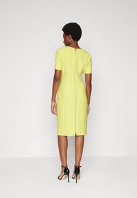 BOSS DAMAISA - Žerzejové šaty - medium yellow