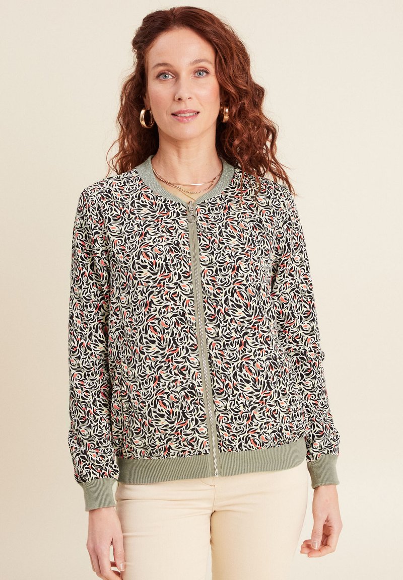 Bomberjacke mit floralem Muster in Creme, Grün, Schwarz und Rot. Rippbündchen und Saum, frontale Reißverschlussverschluss, leichtes Material.