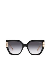 Lunettes de soleil carrées noires oversize avec des verres dégradés gris et des charnières décoratives dorées sur les branches.