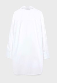 Long-sleeve white shirt dress with buttoned cuffs, back yoke seam, and a classic shirt collar on a light gray background.