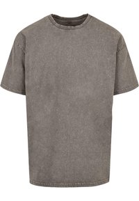 Camiseta de algodón gris con mangas cortas, cuello redondo y un acabado ligeramente desgastado. Diseño limpio sin patrones ni acentos visibles.