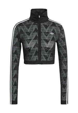 Zwarte cropped ritsjack met hoge kraag, voorzien van een getextureerd chevronpatroon en witte zijstrepen. Gemaakt van lichtgewicht, ademende stof.