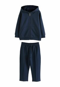 Navy blue zip-up hooded sweatshirt with two front pockets, paired with matching jogger pants featuring an elastic waistband and side pockets.