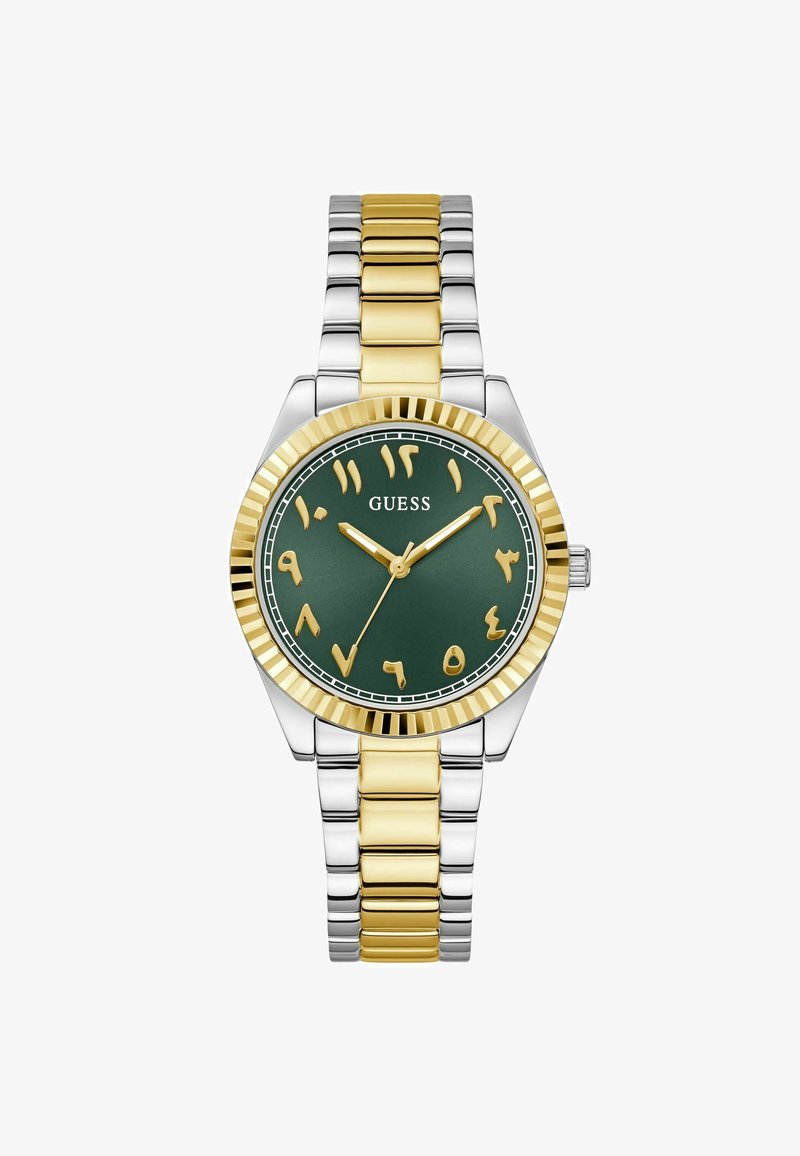 Guld- og sølvfarvet rustfrit stål ur med en grøn urskive, fede guldnummer, og et rillet bezel-design; armbånd med skiftende guldled.