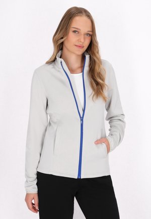 Lysegrå zip-up jakke med blå lynlåse, to sidelommer, tætsiddende pasform og høj krave, lavet af et blødt, strækbart materiale.