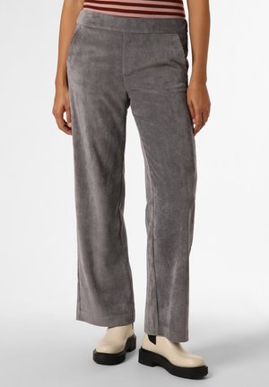 Gray wide-leg corduroy pants worn with cream platform boots on a standing person with hands relaxed by sides.