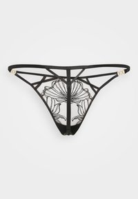 Schwarzer Tanga mit floraler Stickerei auf transparentem Mesh, mit einem Riemendesign und goldfarbenen Hardware-Details.