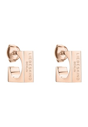 Ohrringe aus Roségoldmetall mit einem geometrischen Design und einer Ausschnittform, graviert mit "LIEBESKIND BERLIN." Glatte Textur und polierte Oberfläche.