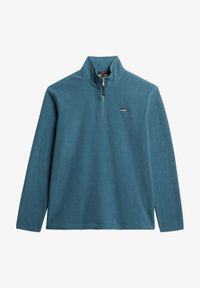 Petrolblauwe fleece pullover met kwartrits en klein zwart berglogo op de borst, afgebeeld op een witte achtergrond.