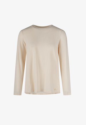 Langärmeliges T-Shirt in Cremefarbe mit Rundhalsausschnitt und einer kleinen dekorativen Schleife nahe dem unteren Saum vor weißem Hintergrund.