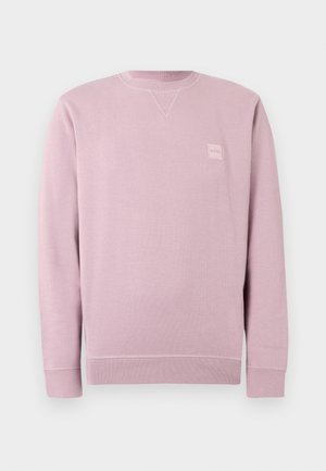 Lyserød sweatshirt lavet af blødt stof, med rund halsudskæring, lange ærmer og en lille firkantet logopatch på fronten.