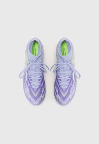 Purple and green soccer cleats with a textured design, featuring a low-profile shape, narrow laces, and a padded collar for comfort.