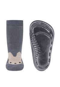 Graue Baumwollsocken mit einem beigen Tiergesicht-Design an der Zehe. Texturiertes schwarzes Gummisohle mit detailliertem Fußform-Muster.