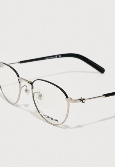 Metallist Montblanci prillid ümarate, läbipaistvate läätsedega, millel on must ülemine raam, hõbedased detailid ja tekstuuriga mustad sangad.