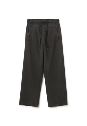 Schwarze, weit geschnittene Hose aus weichem Material. Mit elastischem Bund und Kordelzug, zwei seitlichen Taschen und sauberen Nähten.