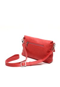 Red leather crossbody bag with textured finish, featuring a front zip pocket and an adjustable strap. Simple rectangular design.