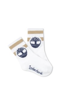 Calze bianche di cotone con polsini a strisce dorate e navy. Presentano un logo ad albero navy Timberland su ogni calza. Texture morbida, design alla caviglia.