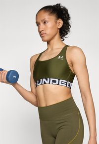 Under Armour HeatGear Mid Branded - Sujetadores deportivos con sujeción media - expedition green/white