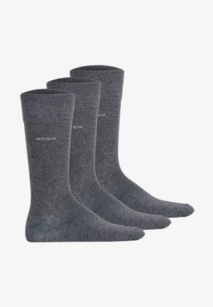 Socks de algodão cinzentas, design até ao joelho, com punho canelado na parte superior, textura suave, apresentando uma marcação subtil perto do tornozelo. Embalagem com três pares.