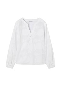 Blouse blanche à manches longues avec motifs floraux subtils, encolure ronde et deux boutons blancs sur la patte de boutonnage avant.