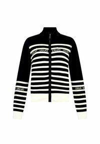 Cardigan a zip in bianco e nero a righe con colletto alto, presenta loghi e decorazioni lungo le righe. Tessuto lavorato a maglia morbido.