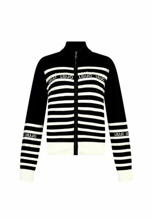Cardigan a zip in bianco e nero a righe con colletto alto, presenta loghi e decorazioni lungo le righe. Tessuto lavorato a maglia morbido.