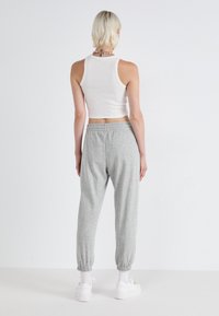 GAP HERITAGE - Jogginghose - light heather grey