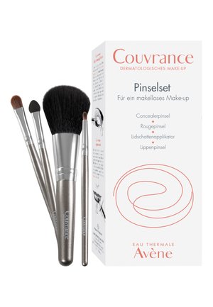 Makeup brush set in silver and black, includes concealer, blush, eyeshadow, and lip brushes, packaged in a white box with red accents.