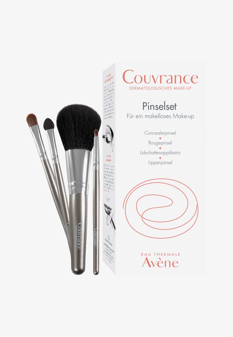 Makeup brush set in silver and black, includes concealer, blush, eyeshadow, and lip brushes, packaged in a white box with red accents.