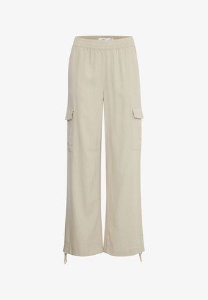 Pantalons cargo larges en lin beige avec taille élastique, deux poches cargo latérales et liens ajustables à l'ourlet.