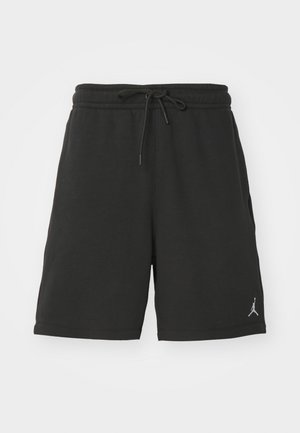 Pantaloni corti sportivi neri realizzati in tessuto morbido, dotati di una vita elastica con cordoncino, tasche laterali e un piccolo logo sulla gamba sinistra.