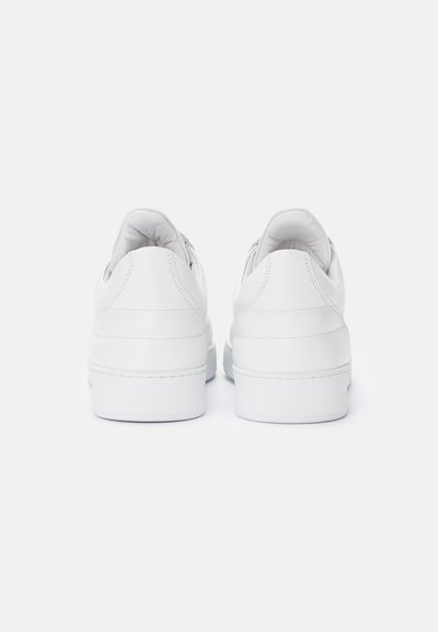 White leather sneakers featuring a smooth finish, rounded shape, and a cushioned insole. The back has subtle seam detailing and a sturdy sole.
