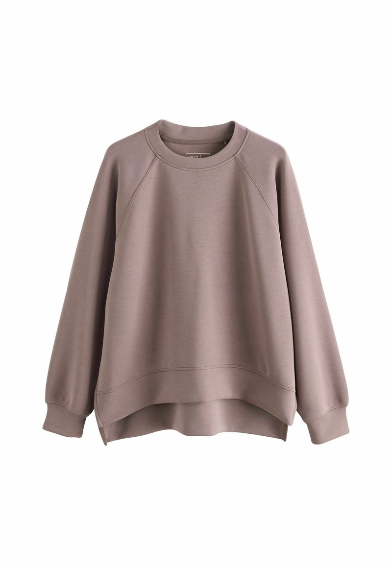 Langærmet sweatshirt i dæmpet mauve, lavet af blødt stof. Har en rund halsudskæring, raglanærmer og en let cropped nederste kant.