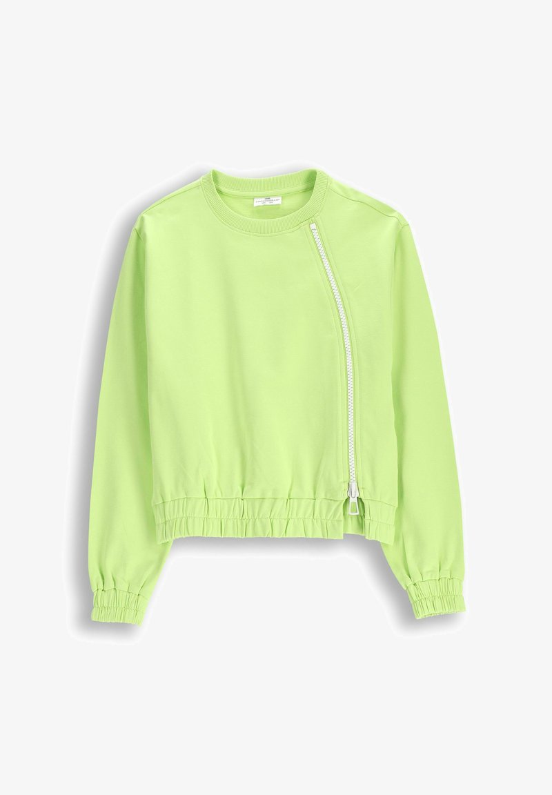 Jasnozielona krótka kurtka wykonana z miękkiego materiału. Posiada boczny zamek błyskawiczny oraz elastyczne mankiety z szeroką, żebrowaną talią.