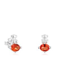 Orecchini a bottone in argento sterling con gemme ovali arancioni, con una finitura lucida e impostazioni a quattro griffe per un tocco di dettaglio in più.
