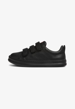 Black leather shoes with a rounded toe, three adjustable Velcro straps, and a textured finish. The sole is cushioned and flat.
