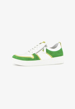 White sneaker with green suede accents, yellow piping, and a side zipper. Classic design features a rubber sole and lace-up front.