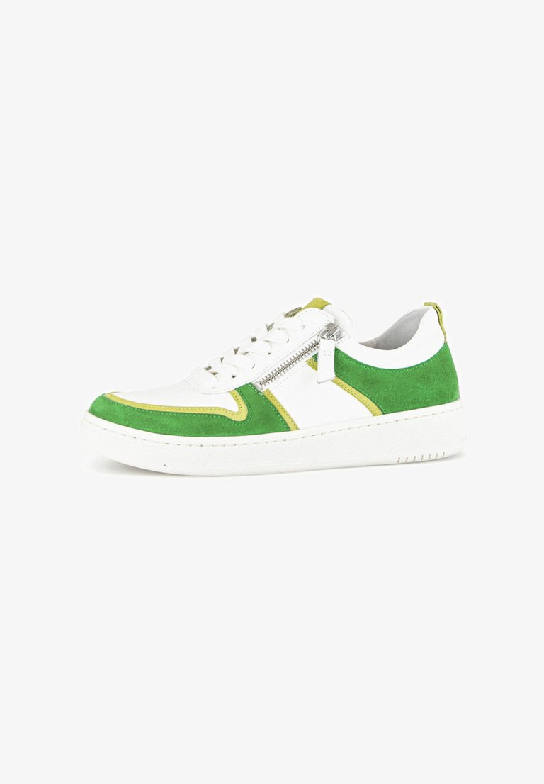 White sneaker with green suede accents, yellow piping, and a side zipper. Classic design features a rubber sole and lace-up front.