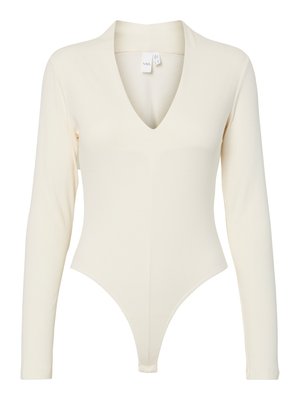 Body a maniche lunghe a coste in crema, con scollatura a V profonda, forma aderente e fondo a perizoma per una silhouette slanciata.