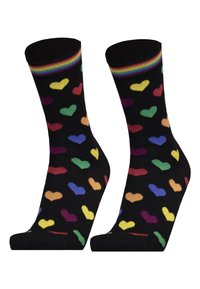 Schwarze Socken mit mehrfarbigen Herzmustern in Rot, Grün, Gelb, Blau, Lila und Orange. Gerippter Regenbogenbund am oberen Ende.