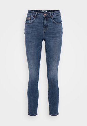 Mørkeblå skinny jeans laget av denim med en glatt tekstur, fem-lomme design og kobber knappdetalj i taljen.