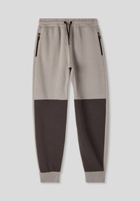 Szare i ciemnobrązowe dresy z blokowaniem kolorów, z elastycznym pasem ze sznurkiem, kieszeniami na zamek, ściągaczami na kostkach i miękką teksturą.