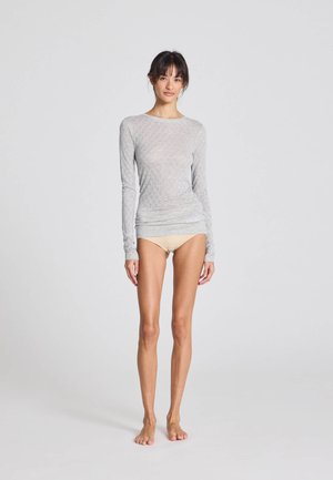 Light gray long-sleeve top with a textured diamond pattern, fitted design, and a crew neck; paired with neutral-colored briefs.