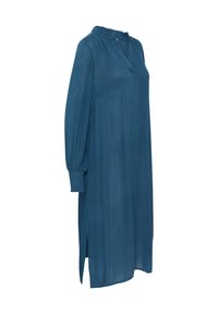 Türkises Kleid aus leichtem Stoff, mit Stehkragen, langen Puffärmeln und seitlichen Schlitzen für Bewegungsfreiheit.